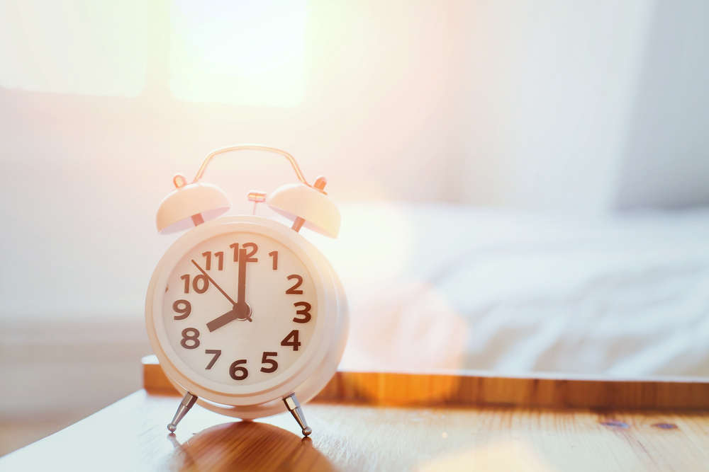 Alarm clock next to mattress