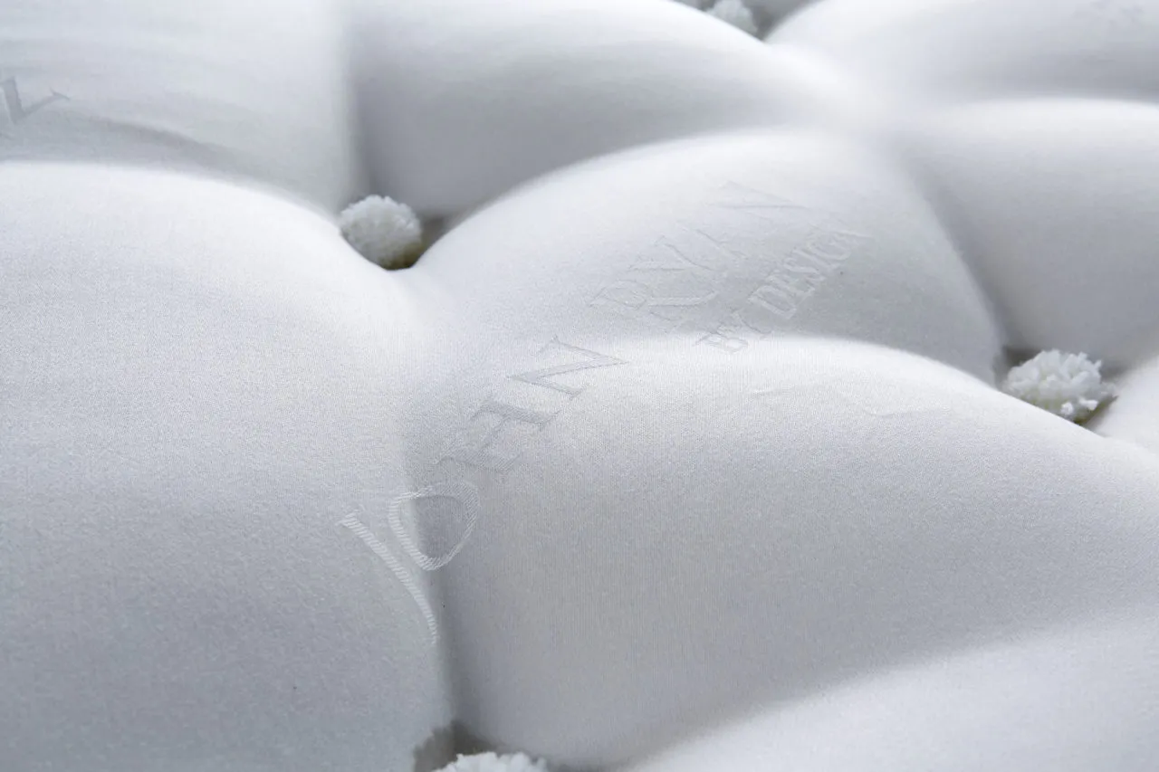 Close up of Artisan mattress with tufting