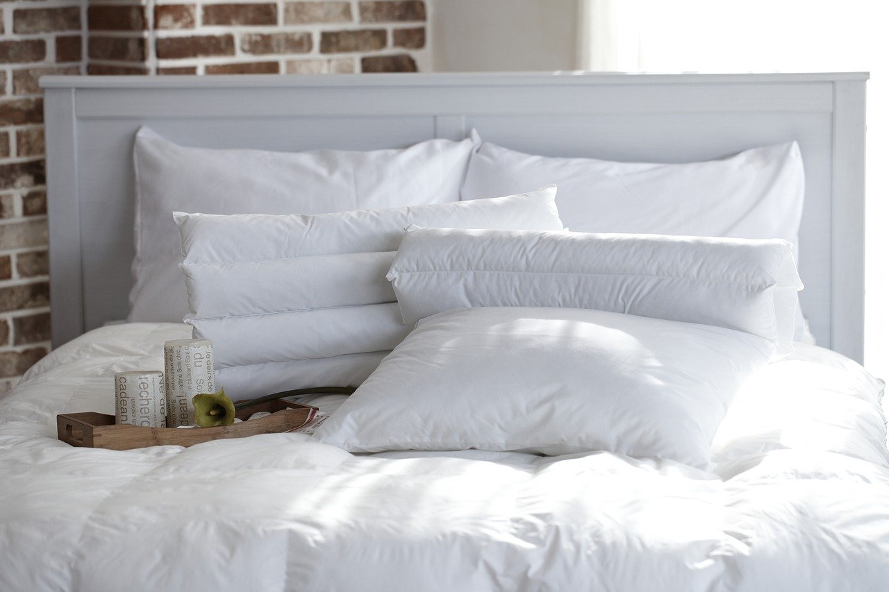 White bed and pillows in a bedroom