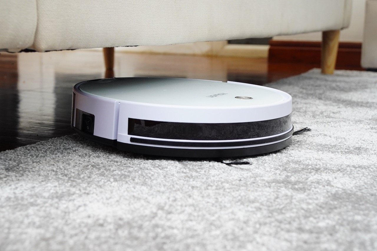 A robotic hoover in a bedroom