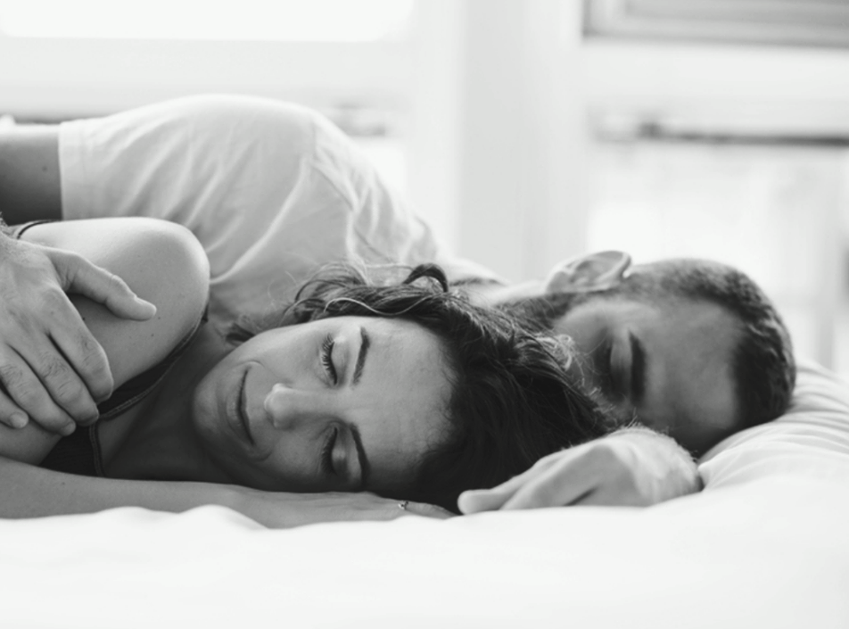 A sleeping couple in bed