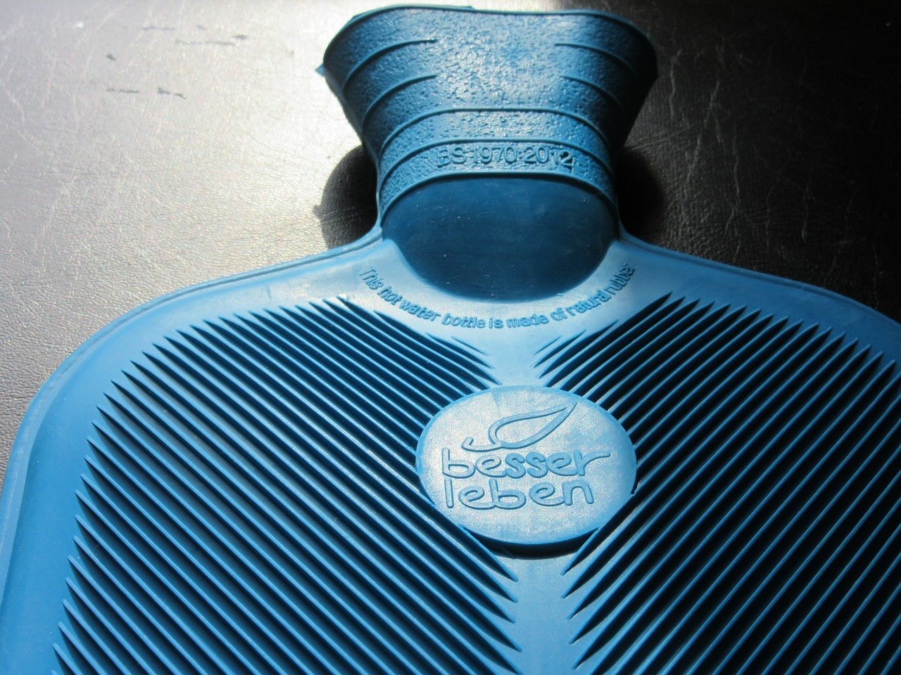 A rubberised hot water bottle