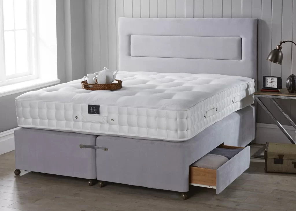 A thick mattress on a divan base